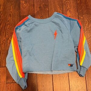 Aviator Nation Light Blue Cropped Sweatshirt with Rainbow Sleeve Stripes
